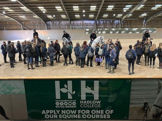 Students on horses with Hadlow banner visible