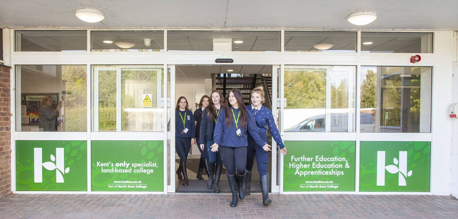 Students coming out of Hadlow College branded building